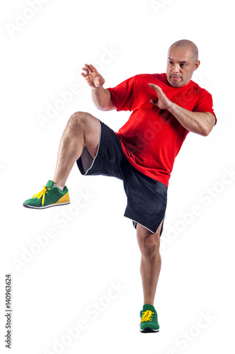 Studio portrait of fighting muscular man over white background