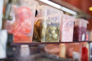 containers with food at restaurant kitchen