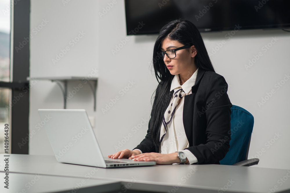 Young attractive & beautiful woman in an office Young attractive & beautiful woman in an office