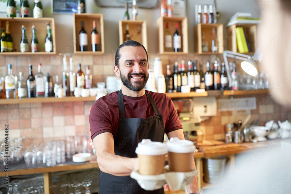man or waiter serving customer in coffee shop