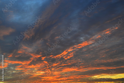 look at the beautifully colored clouds at sunrise © sowicz