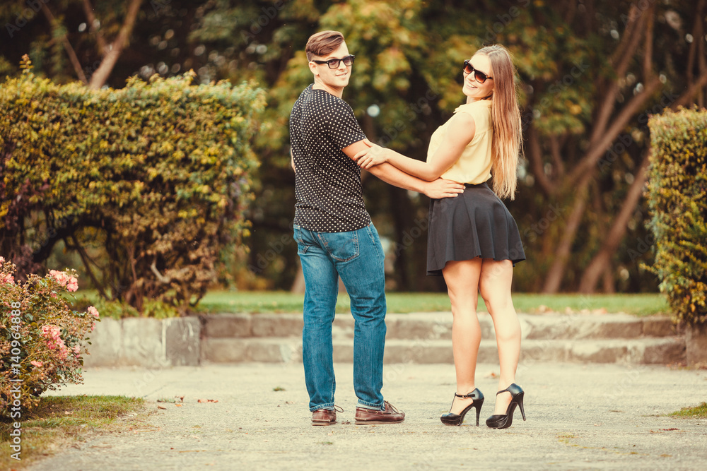 Fototapeta premium Couple in park taking walk.