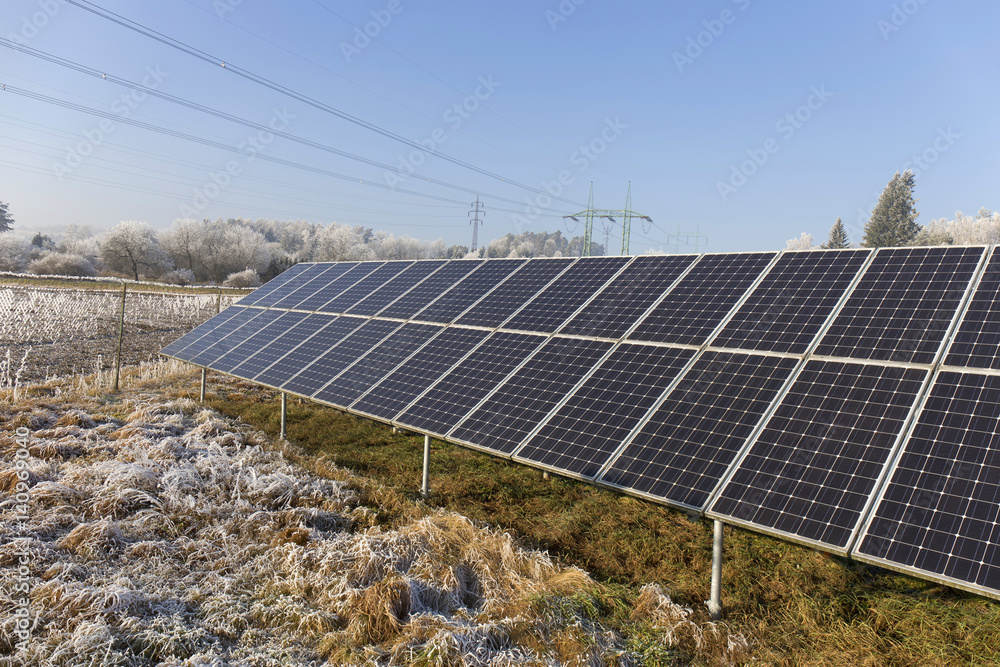 Solar Power Station in the snowy freeze winter Nature 