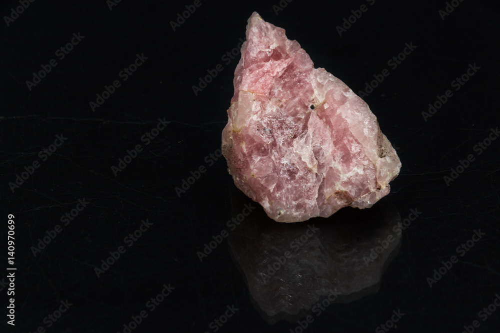 Rhodochrosite on black background from personal collection of Semi-precious stones and minerals Rhodochrosite on black background from personal collection of Semi-precious stones and minerals