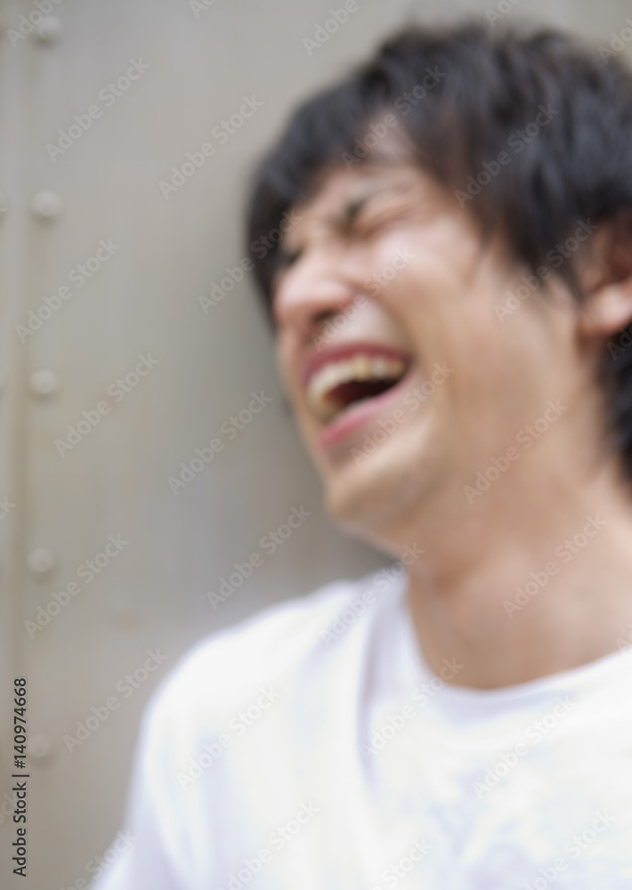 Obraz premium Laughing young man