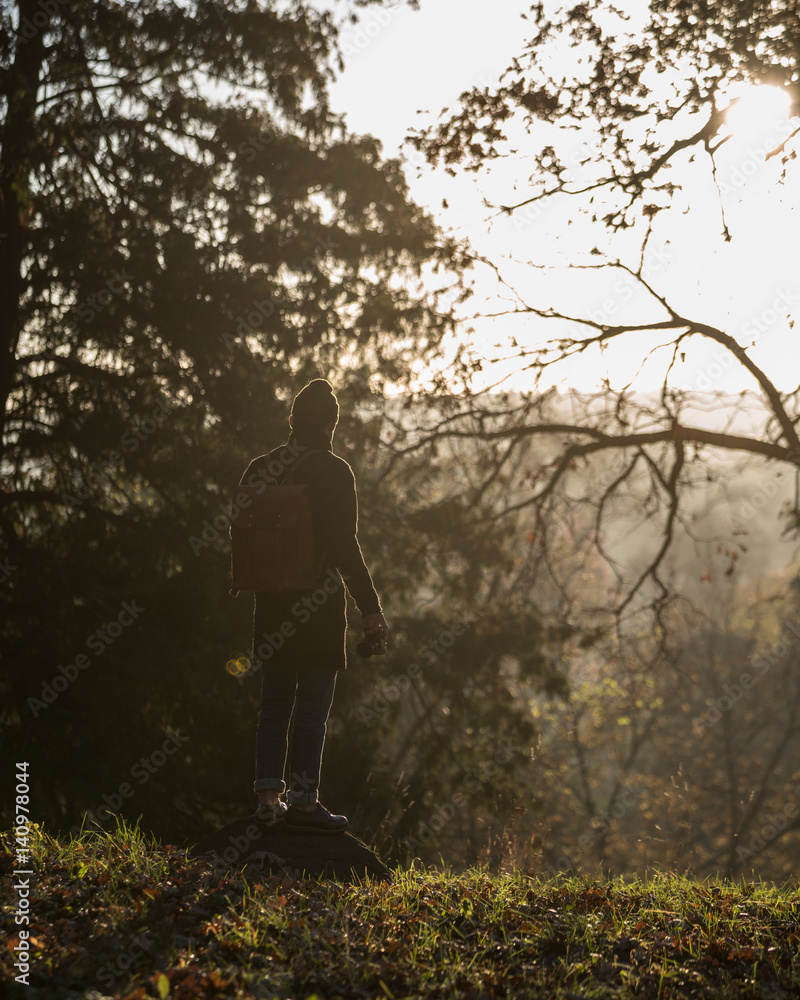 Man on Hilltop Overlooking Nature at Sunrise Man on Hilltop Overlooking Nature at Sunrise