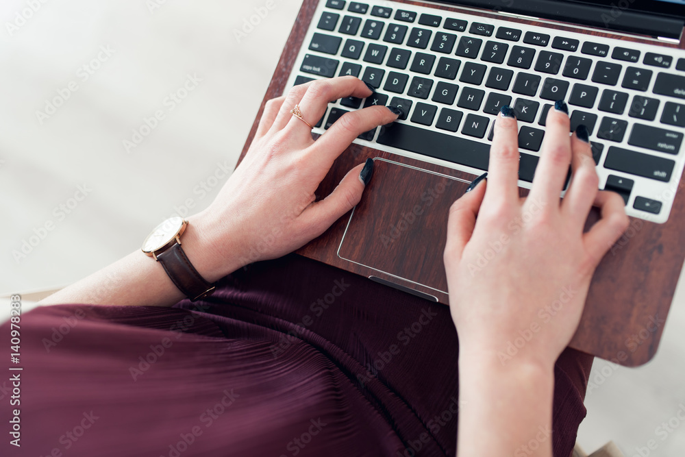 Woman Typing on Her Laptop