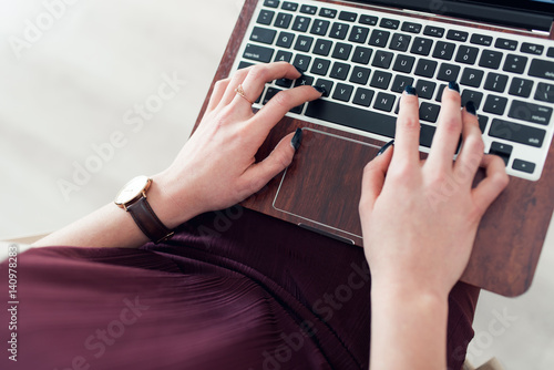 Woman Typing on Her Laptop