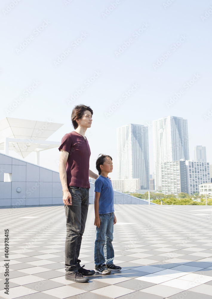 Father and son standing