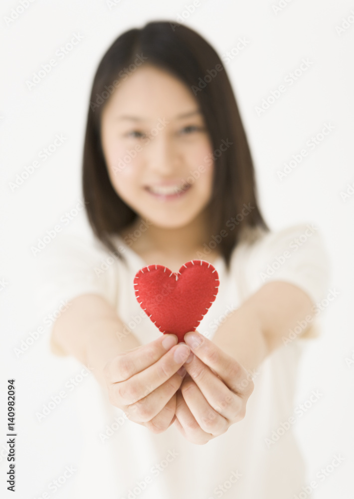 Woman Holding Heart Shaped Object Woman Holding Heart Shaped Object
