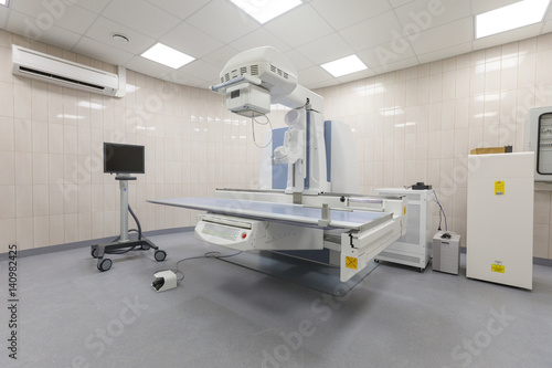 X-ray room in a hospital ER operating room with a classic ceiling-mounted x-ray system