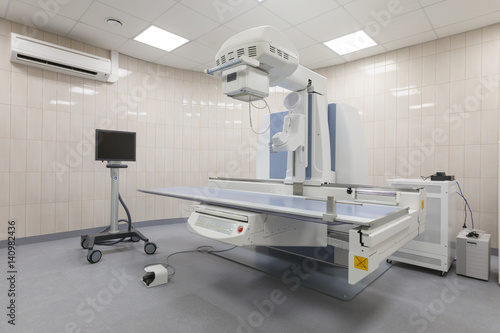 X-ray room in a hospital ER operating room with a classic ceiling-mounted x-ray system