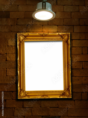 Vintage photo frame on brick wall with single light lamp