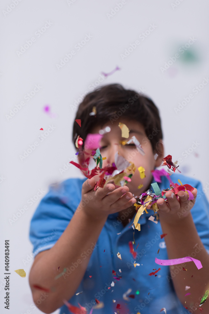 Fototapeta premium kid blowing confetti