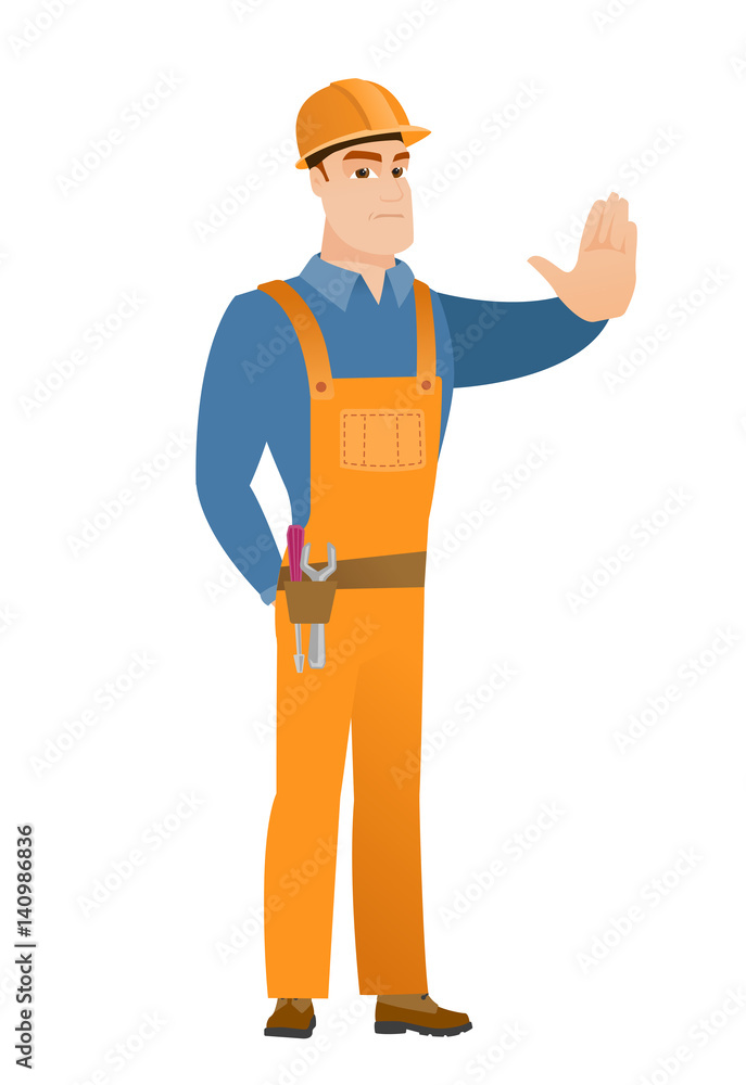 Caucasian builder showing stop hand gesture. Caucasian builder showing stop hand gesture.