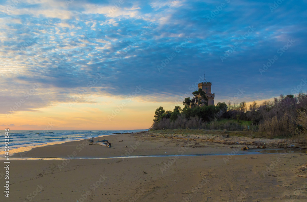 Pineto (Abruzzo, Italy) - The sunrise on the Adriatic sea, from the Pineto beach, beside the Torre di Cerrano castle