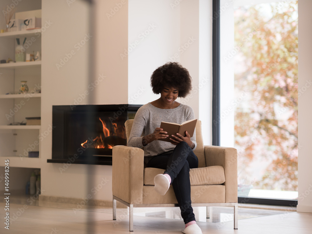 black woman at home reading book black woman at home reading book