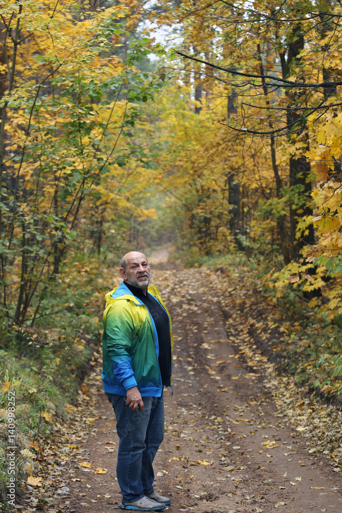 portrait of a man in the autumn forest portrait of a man in the autumn forest