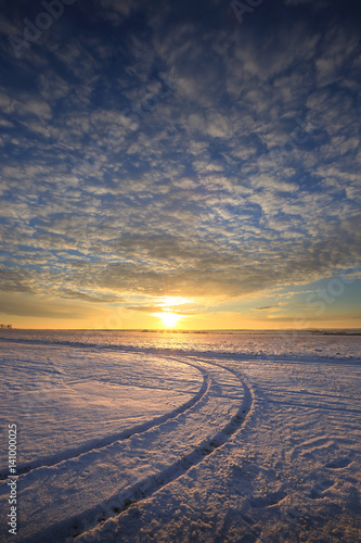 colorful sunrise over the snow-covered field