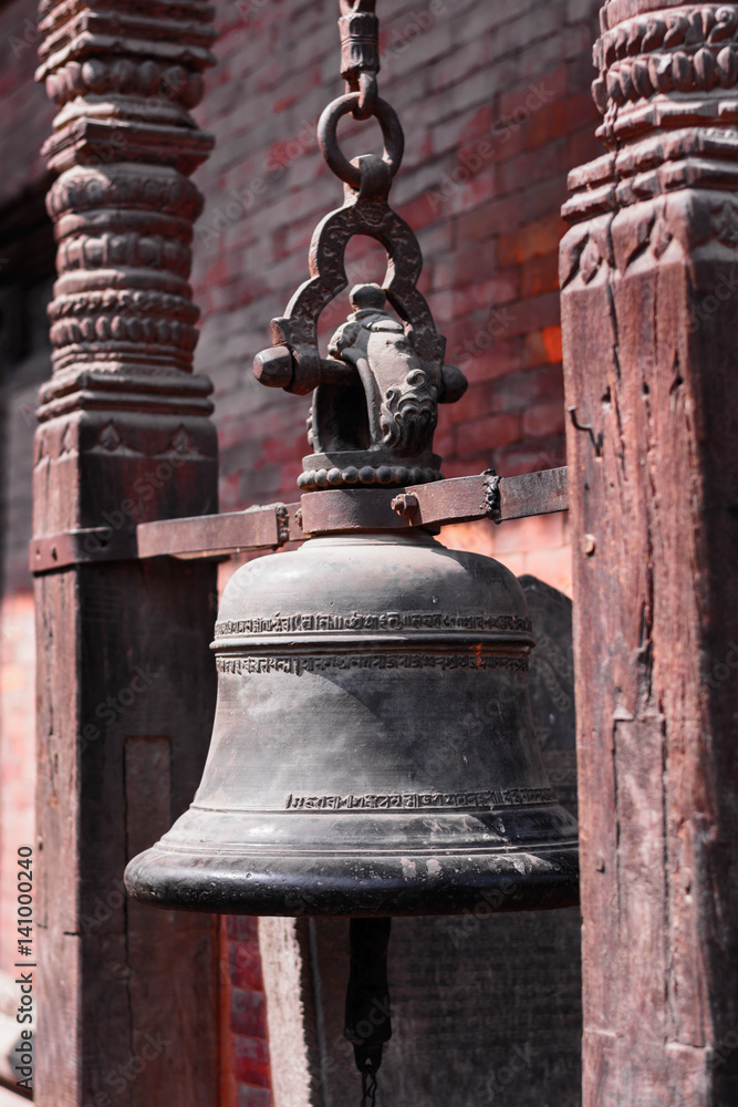 Obraz premium background of bronze temple bell with scriptures in it,