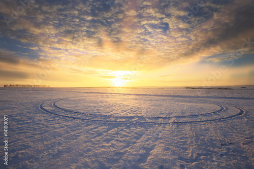 colorful sunrise over the snow-covered field