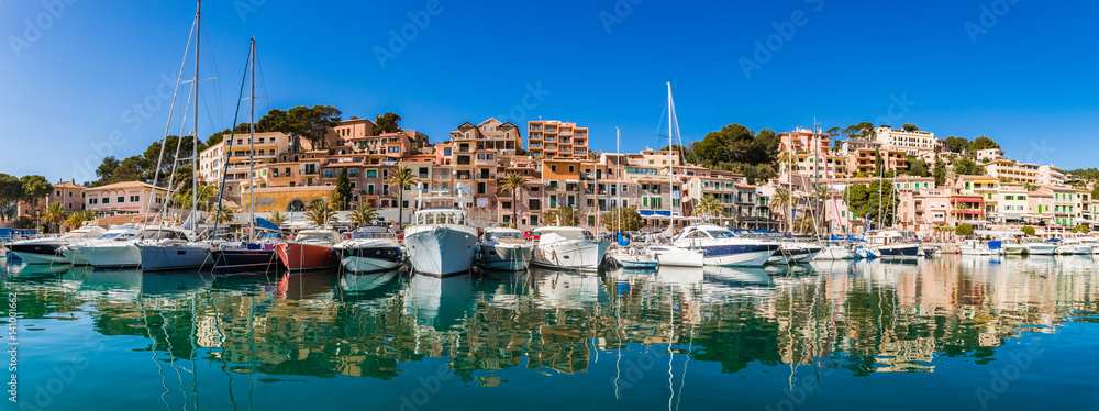 Beautiful panorama view of Port de Soller harbor with luxury boats and mediterranean buildings on Majorca Spain
