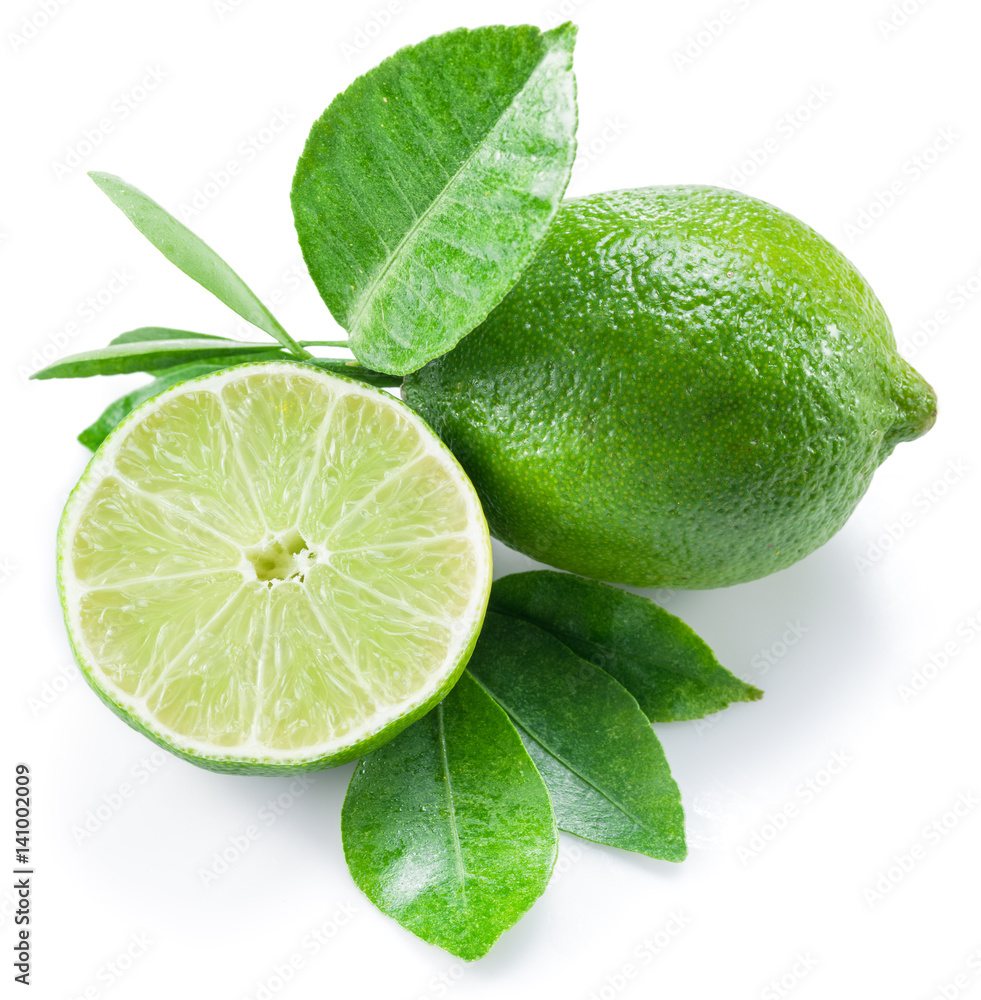 Ripe lime fruit with a half of lime on the white background. Ripe lime fruit with a half of lime on the white background.