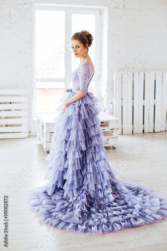 Obraz na płótnie Beautiful girl in evening lilac dress