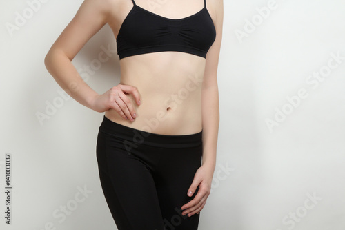 stomach of thin, sports girl