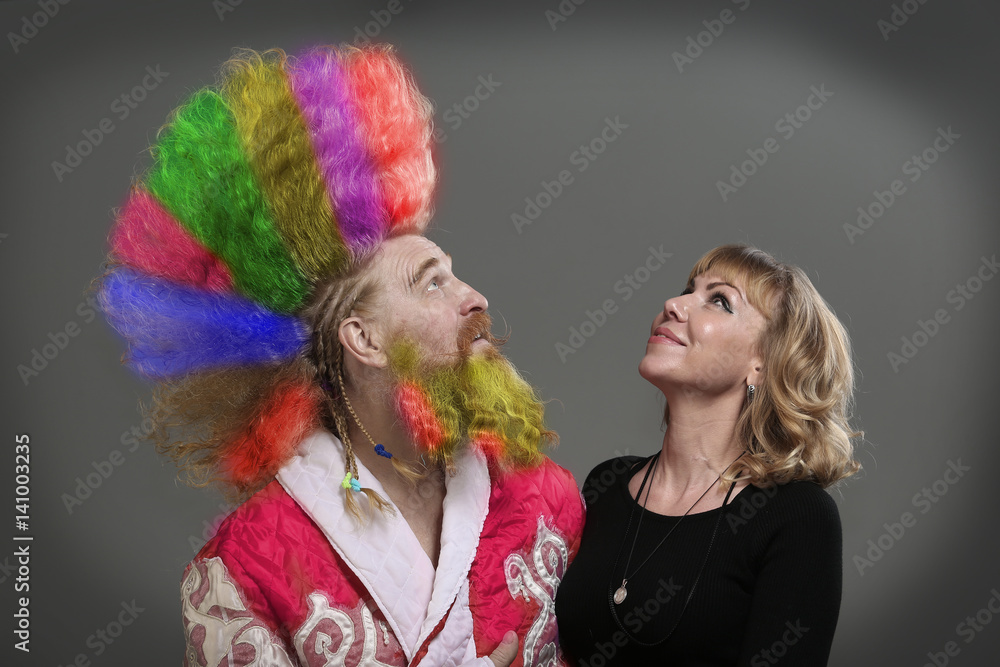 funny Santa Claus with a beautiful girl funny Santa Claus with a beautiful girl