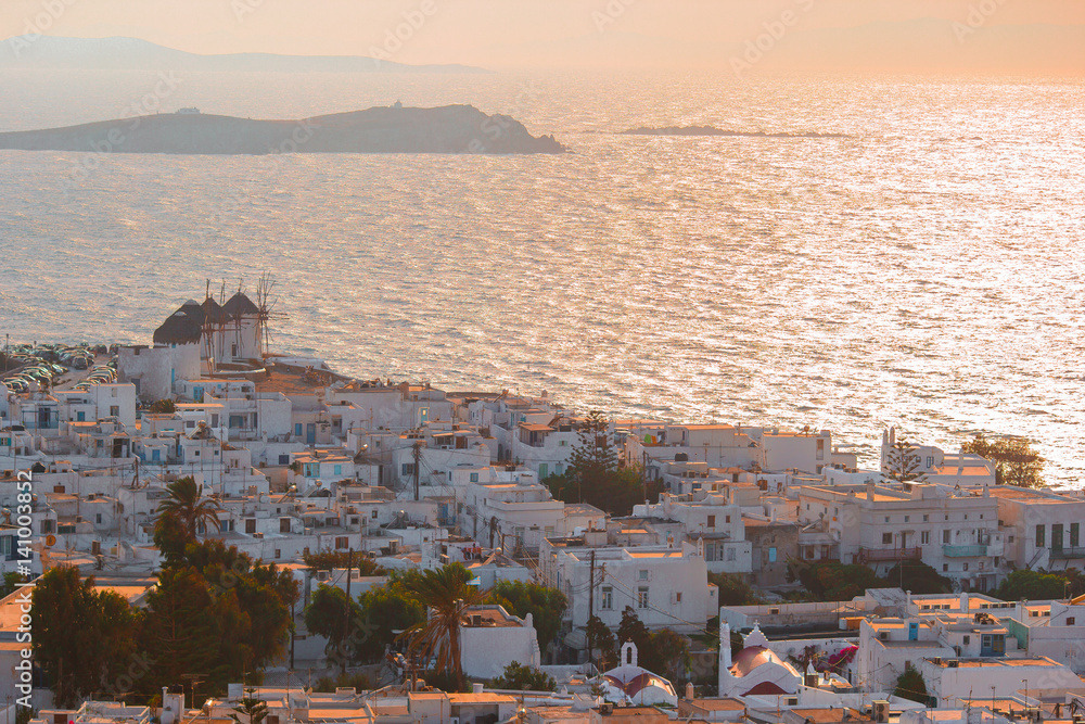 Top view of the old city and the sea on the island of Mykonos in evening lights