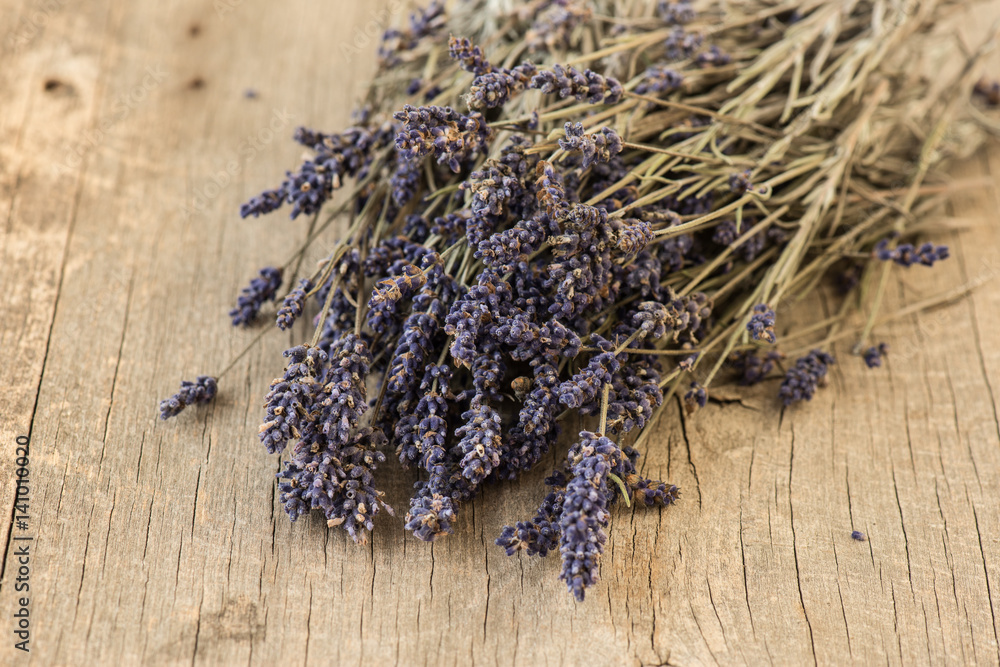 Bundle of lavender on rustic wooden background Bundle of lavender on rustic wooden background