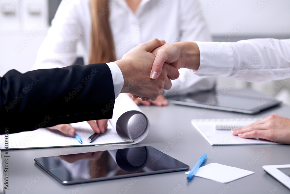 Business people shaking hands at meeting. Clouse up of handshake Business people shaking hands at meeting. Clouse up of handshake