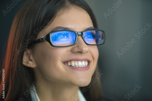 The happy woman in glasses