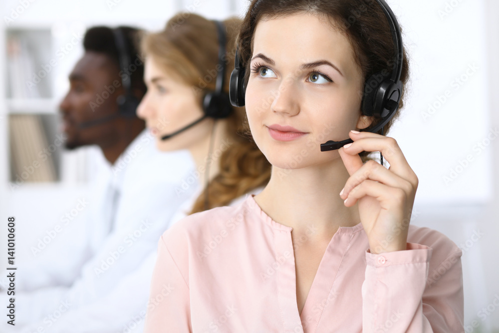 Call center operator.Young beautiful business woman in headset. Call center operator.Young beautiful business woman in headset.