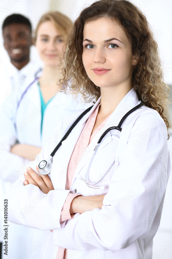 Medical team of confident doctors showing Ok sign and ready to help. Medicine and health care, insurance concept Medical team of confident doctors showing Ok sign and ready to help. Medicine and health care, insurance concept