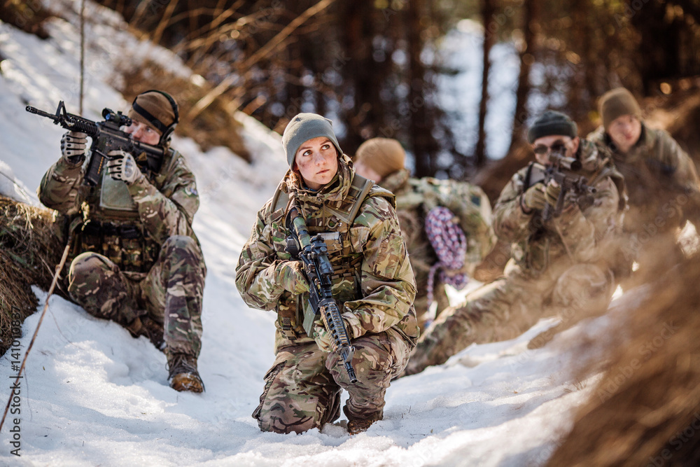 team of special forces weapons in cold forest. Winter warfare and military concept team of special forces weapons in cold forest. Winter warfare and military concept