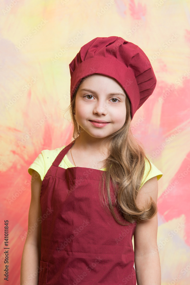 small girl chef with happy face in hat and apron small girl chef with happy face in hat and apron