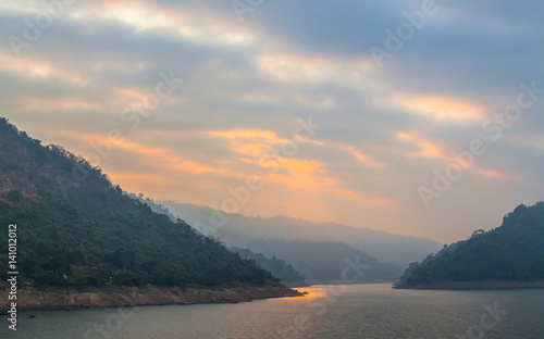 sun rise above the dam