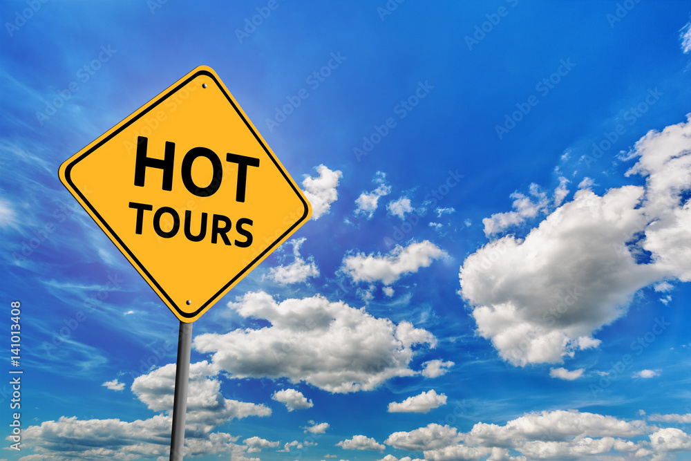 Blue cloudy sky and yellow road sign Blue cloudy sky and yellow road sign