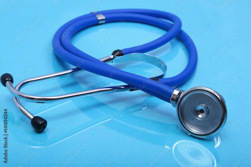 Stethoscope and medical equipmenton on blue background Stethoscope and medical equipmenton on blue background