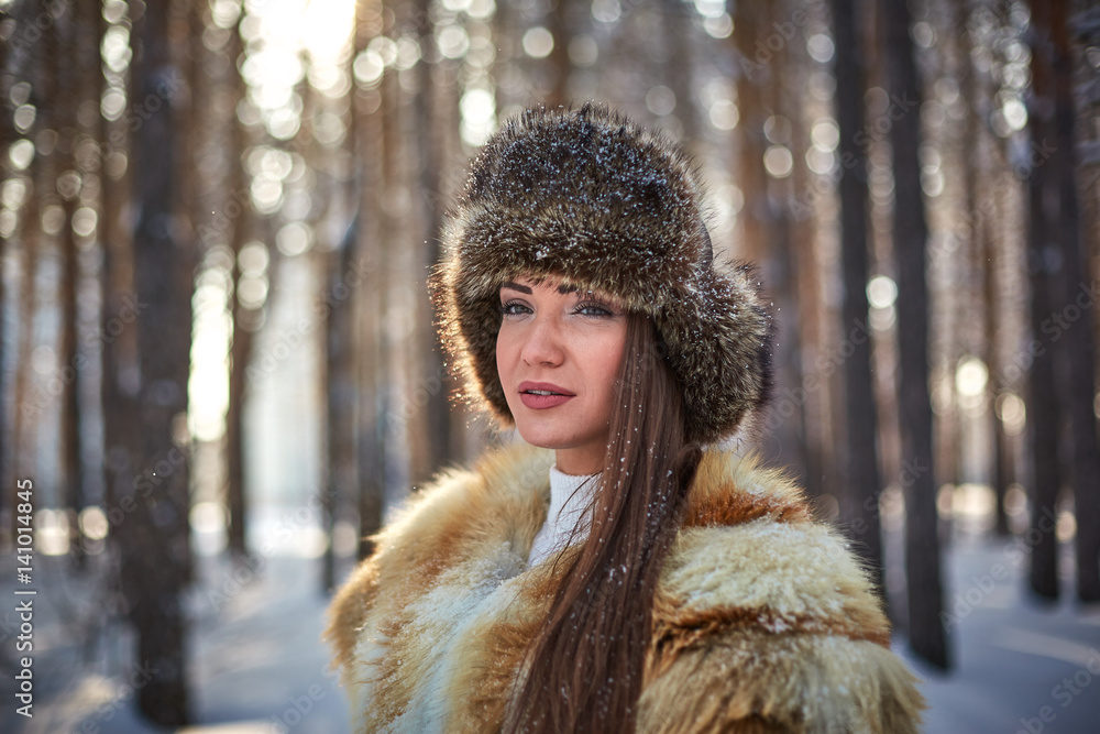 beautiful girl in fur vest in winter forest beautiful girl in fur vest in winter forest