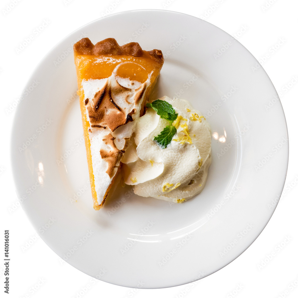 A piece of orange tart on a white plate isolated with cliping path