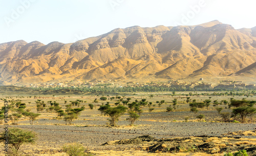 Typical moroccan kasbah in desert photo