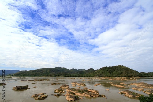 Water eroded rocks and islets in mekong river at sangkhom district, Nong Khai province, Thailand. photo