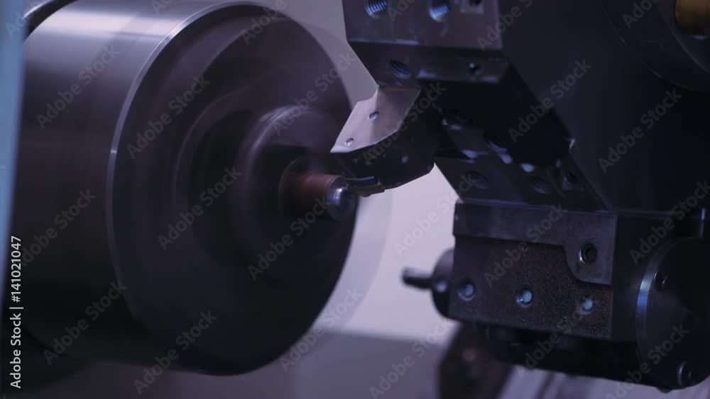 Metal turning. CNC machine tool cuts out metal parts. Automatic production process. Сlose-up. 4k footage.
Metal turning. CNC machine tool cuts out metal parts. Automatic production process. Сlose-up. 4k footage.