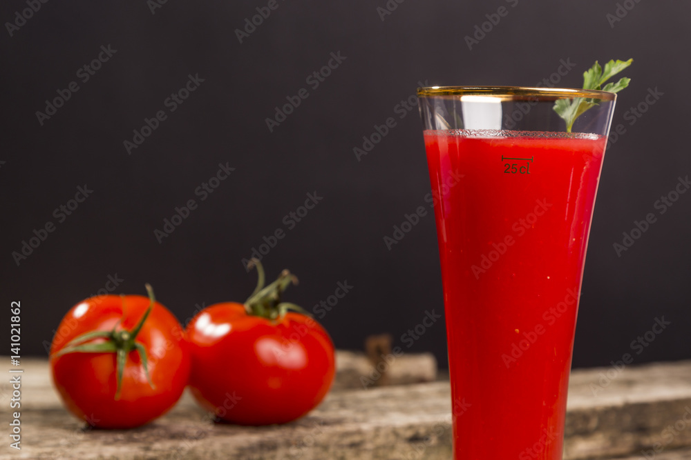 tomato juice based drink on black background. tomato juice based drink on black background.