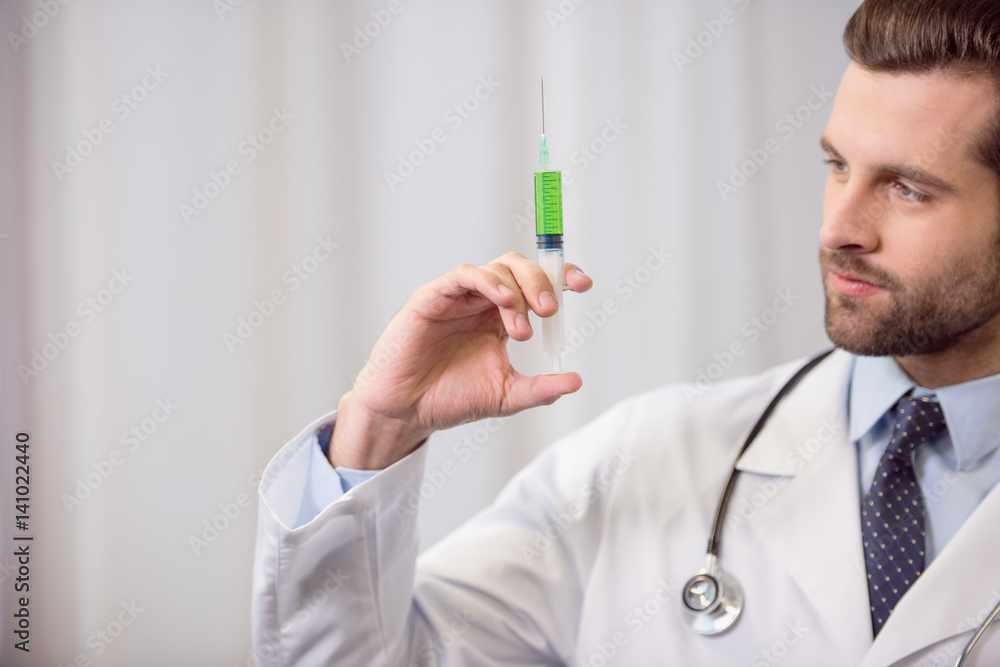 Doctor holding syringe Doctor holding syringe