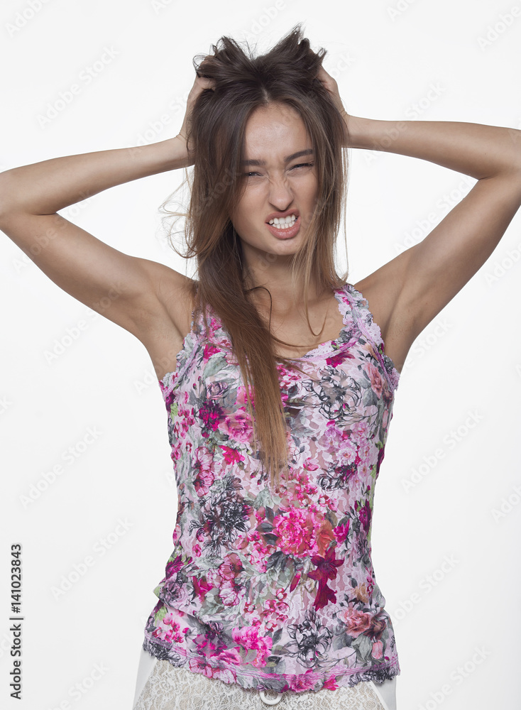 Portrait of beautiful girl model in casual summer clothes with no makeup on white background Portrait of beautiful girl model in casual summer clothes with no makeup on white background