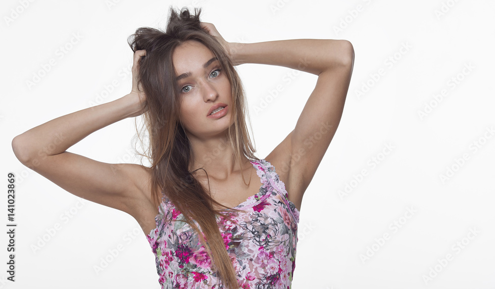 Portrait of beautiful girl model in casual summer clothes with no makeup on white background Portrait of beautiful girl model in casual summer clothes with no makeup on white background